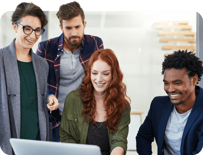 Group of coworkers looking at laptop screen